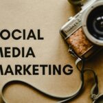 A vintage camera on brown paper with 'SOCIAL MEDIA MARKETING' text, perfect for marketing visuals.